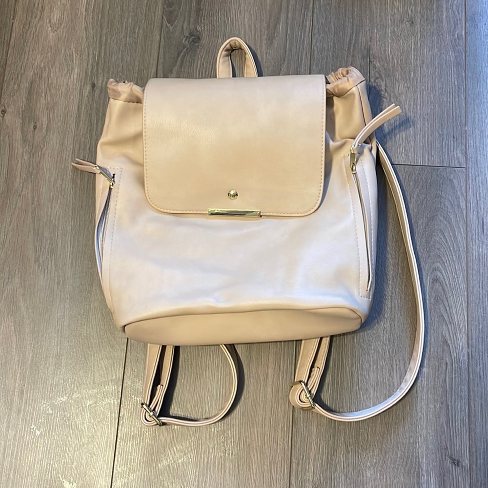 beige purse backpack